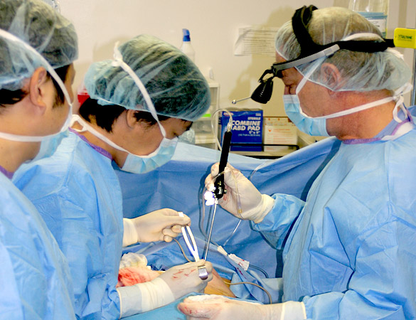Dr. Michael Pasquale performing breast augmentation surgery with Dr. Takayuki Cuvo from Japan.